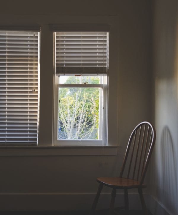 showing how to pull down blinds stuck at top