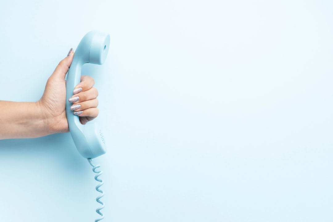 Get in touch by telephone in blue background